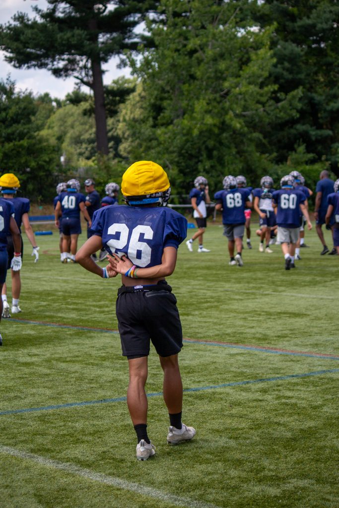 Framingham senior running back Akye Boston carrying Flyers football