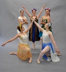 5 dancers pose. They are portraying the Earth, Sun, Rain, Air and a nature witch.