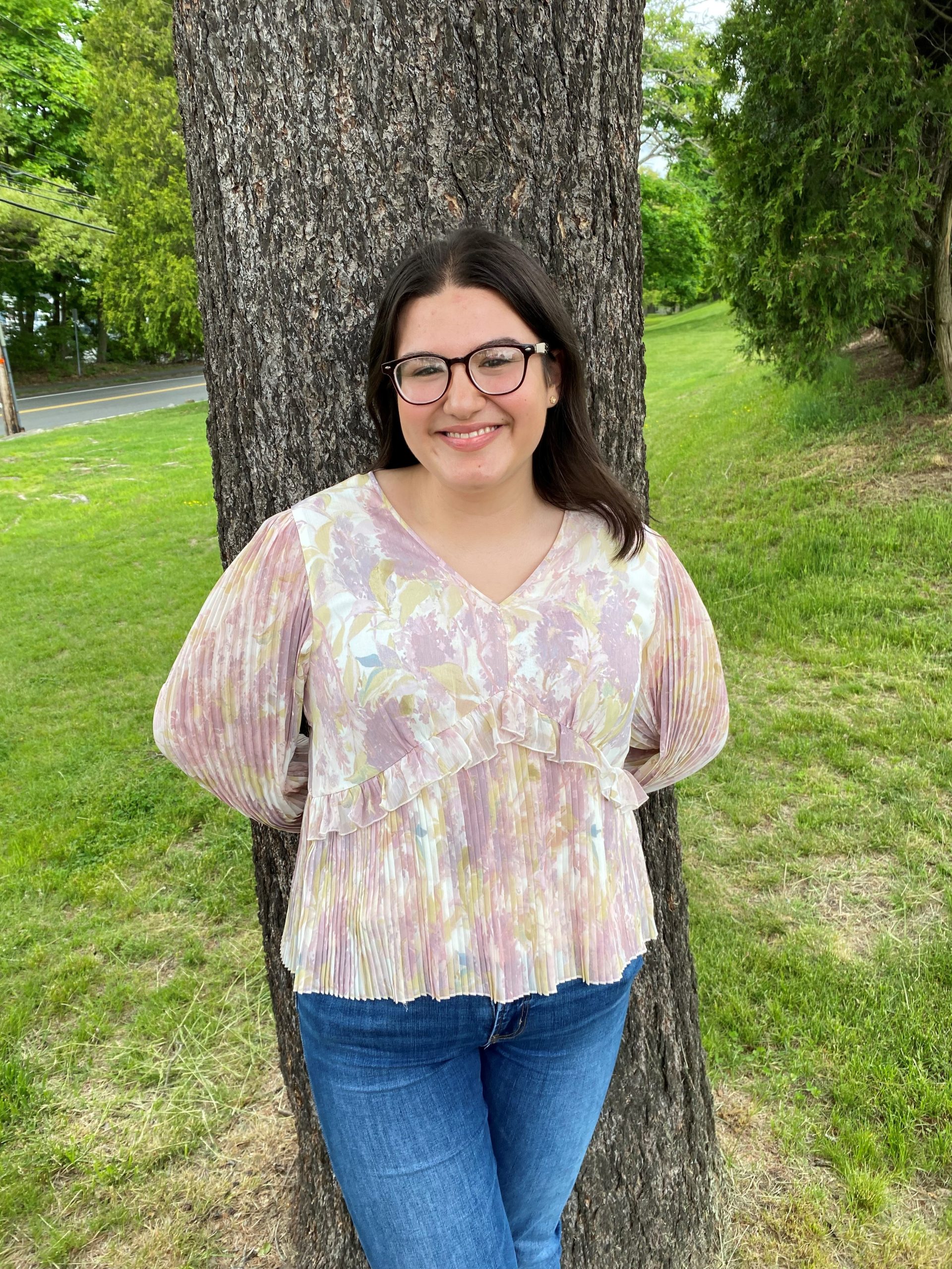 MassBay Community College graduate Melissa Ribeiro of Milford, MA, poses on the Wellesley Hills campus, Wellesley Hills, MA, May 2024 (Photo/ MassBay Community College)