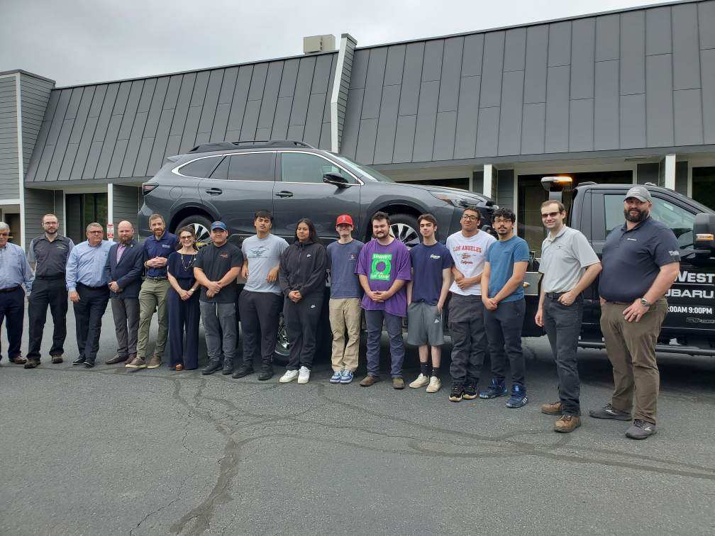 MassBay Community College automotive technology faculty, staff and students pose with a recently donated 2023 Subaru Outback from Subaru of New England to support MassBay’s All Brand Automotive Technology program, Ashland, MA, June 2024 (Photo/ MassBay Community College).