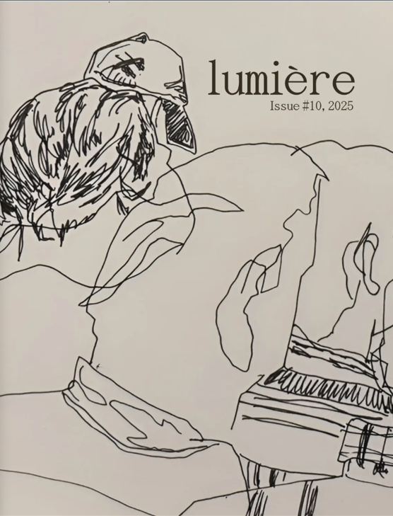 Illustrated magazine cover with a minimalist black line drawing of two seated figures shown from behind, leaning slightly toward each other. One figure wears a baseball cap. The background is light beige. Text in the upper right reads, “lumière, Issue #10, 2025.”